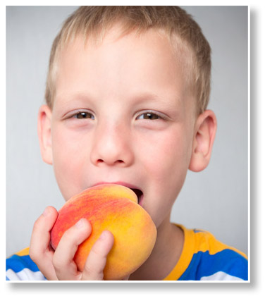 Boy Eating Peach